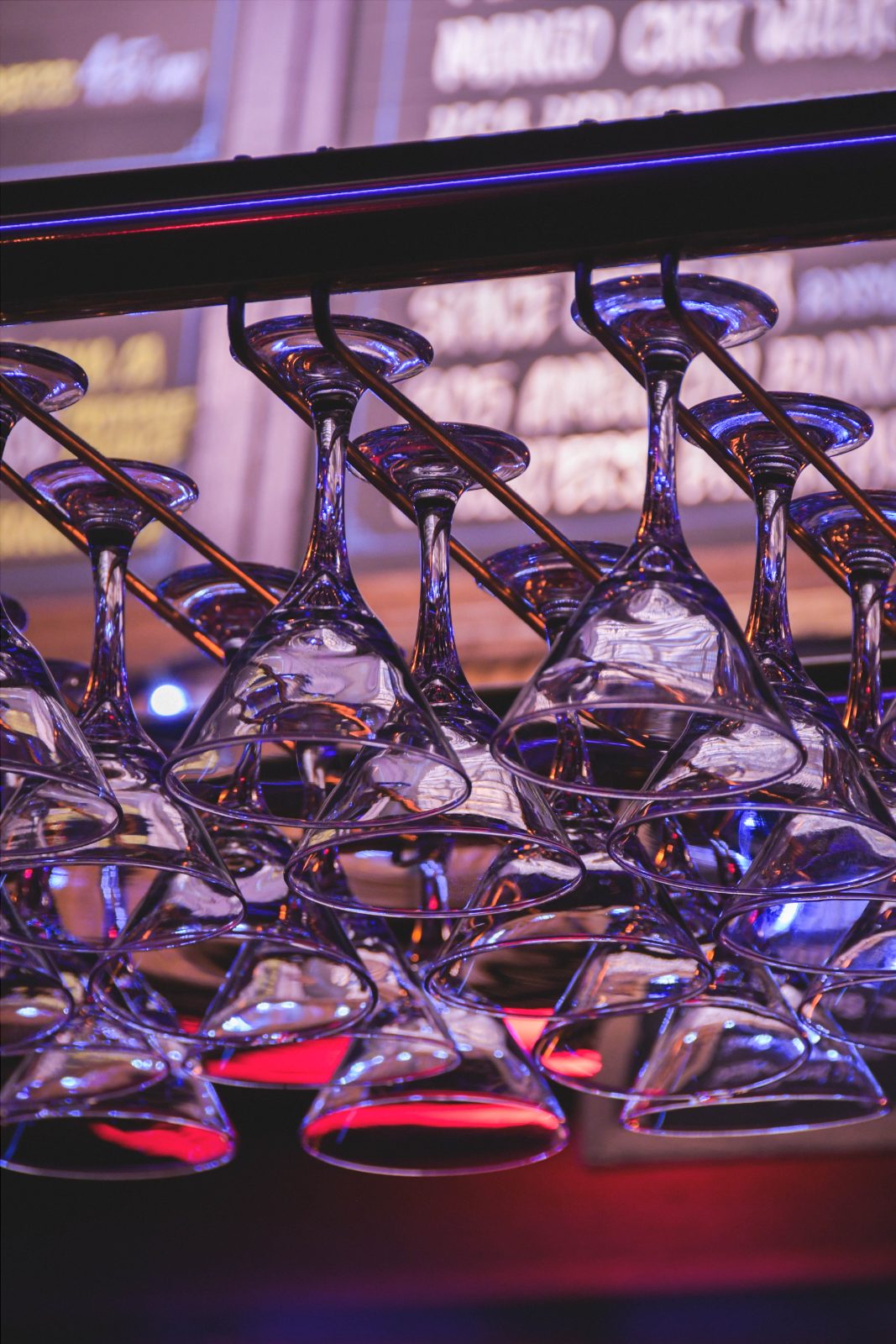 Martini glasses hanging over the bar