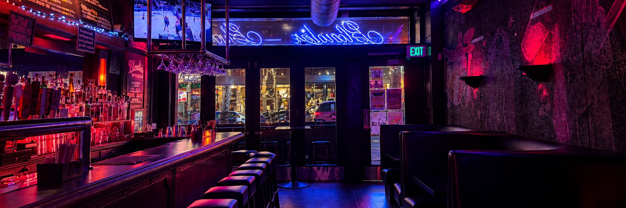 Inside Blondie's Bar — the bar, booths and neon sign